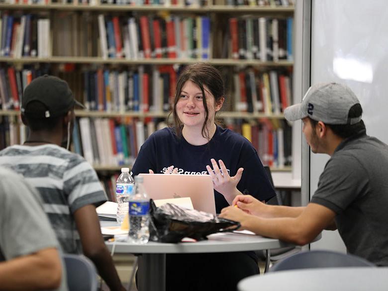 students being tutored in classroom setting